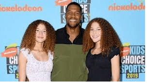 Michael with his twin daughters